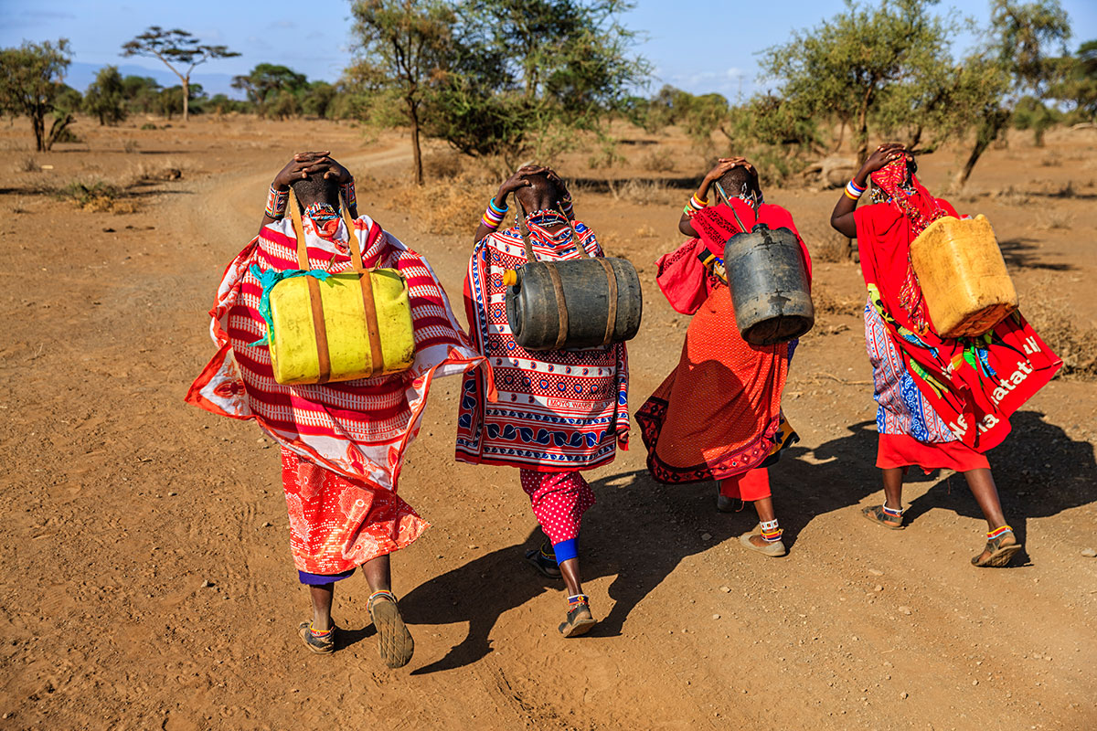 maasai women carrying water