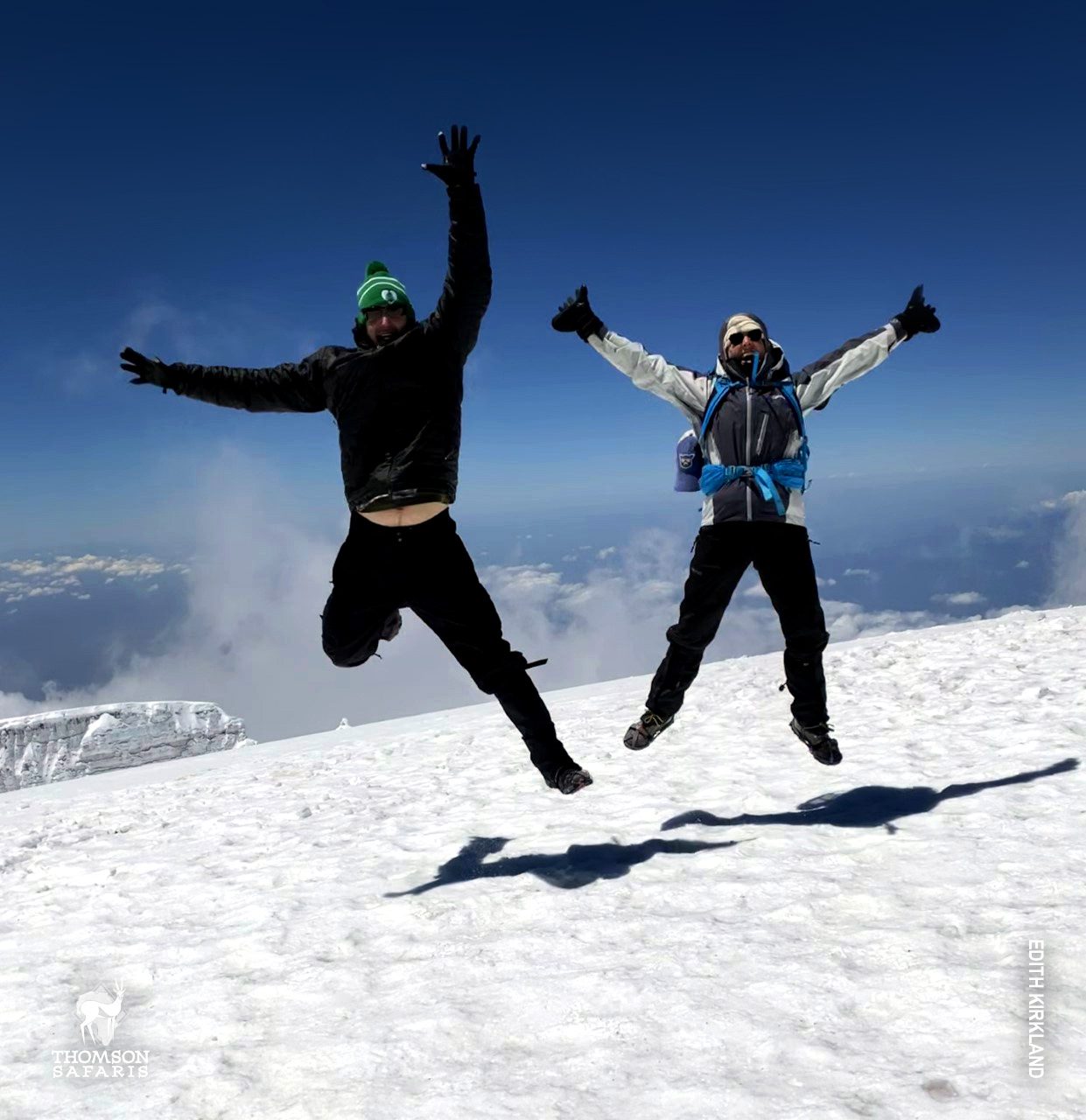 jumping at summit of mount kilimanjaro