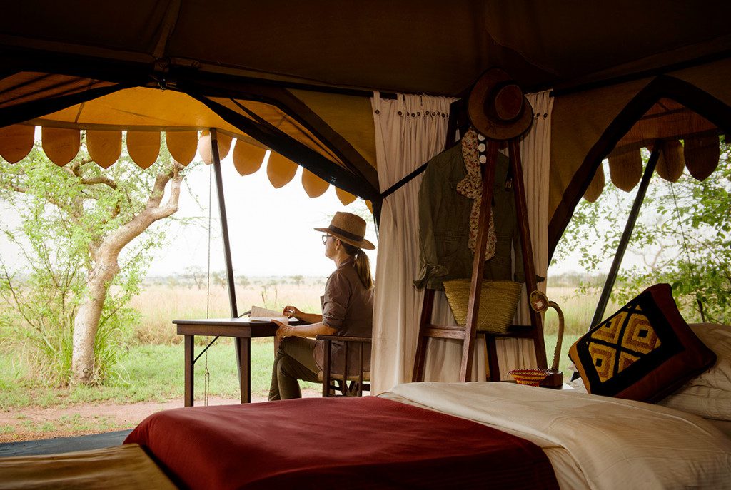 guest inside safari tent in tanzania