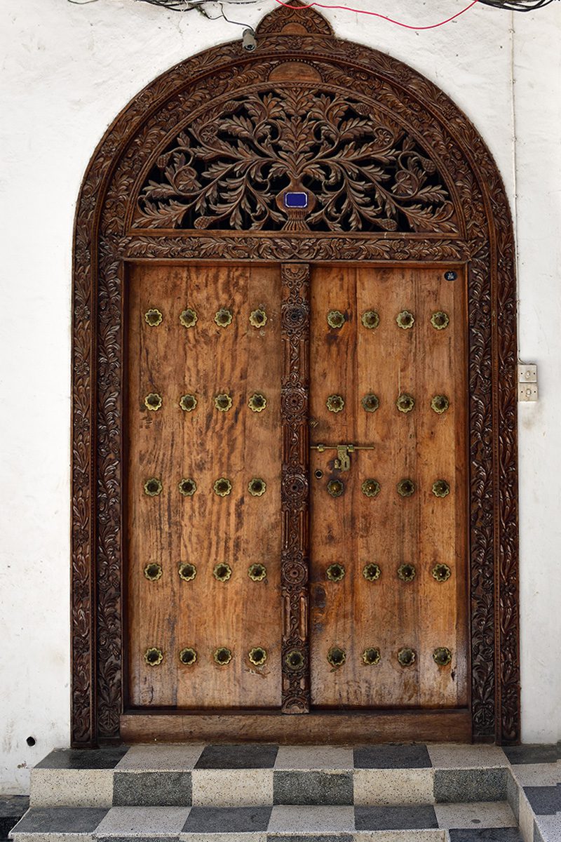 carved wooden door of stone town zanzibar