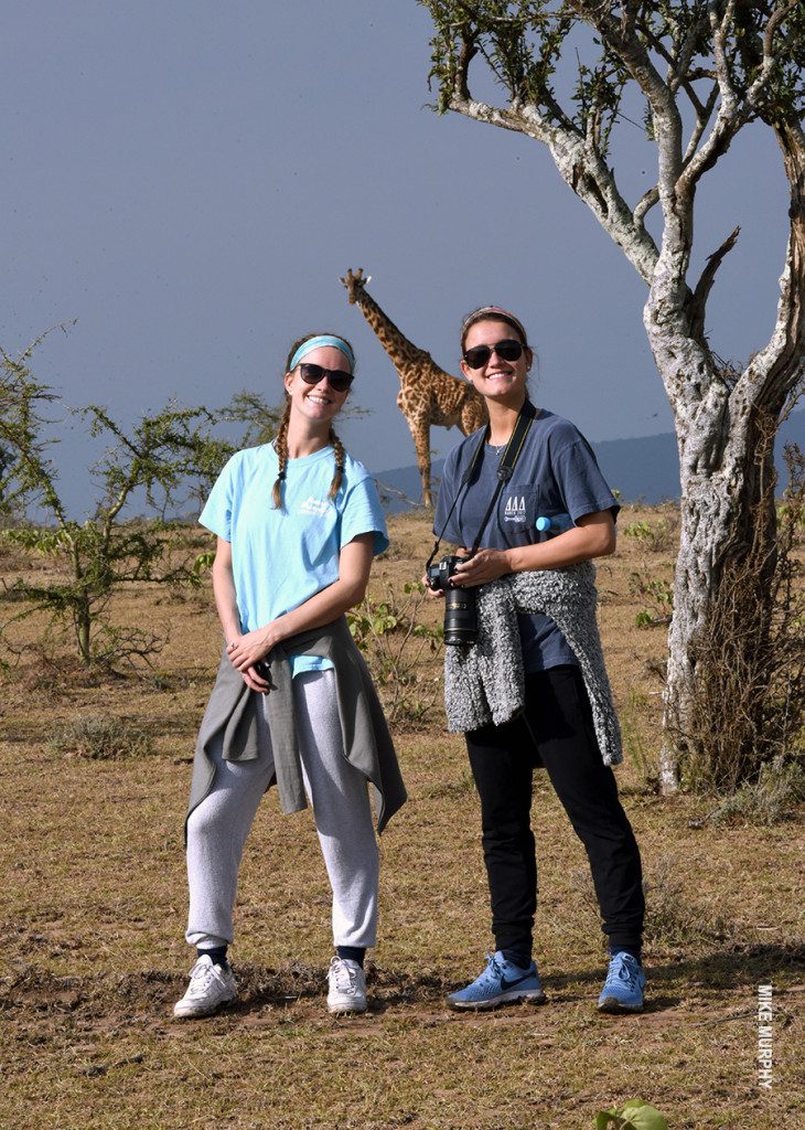 girls find giraffe on walking safari