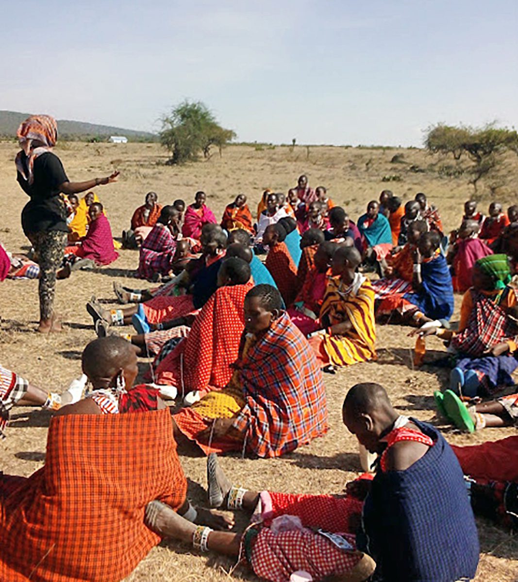 asela teaching maasai women about honey collection from beehives