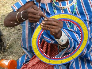 maasai woman beading with cocoba
