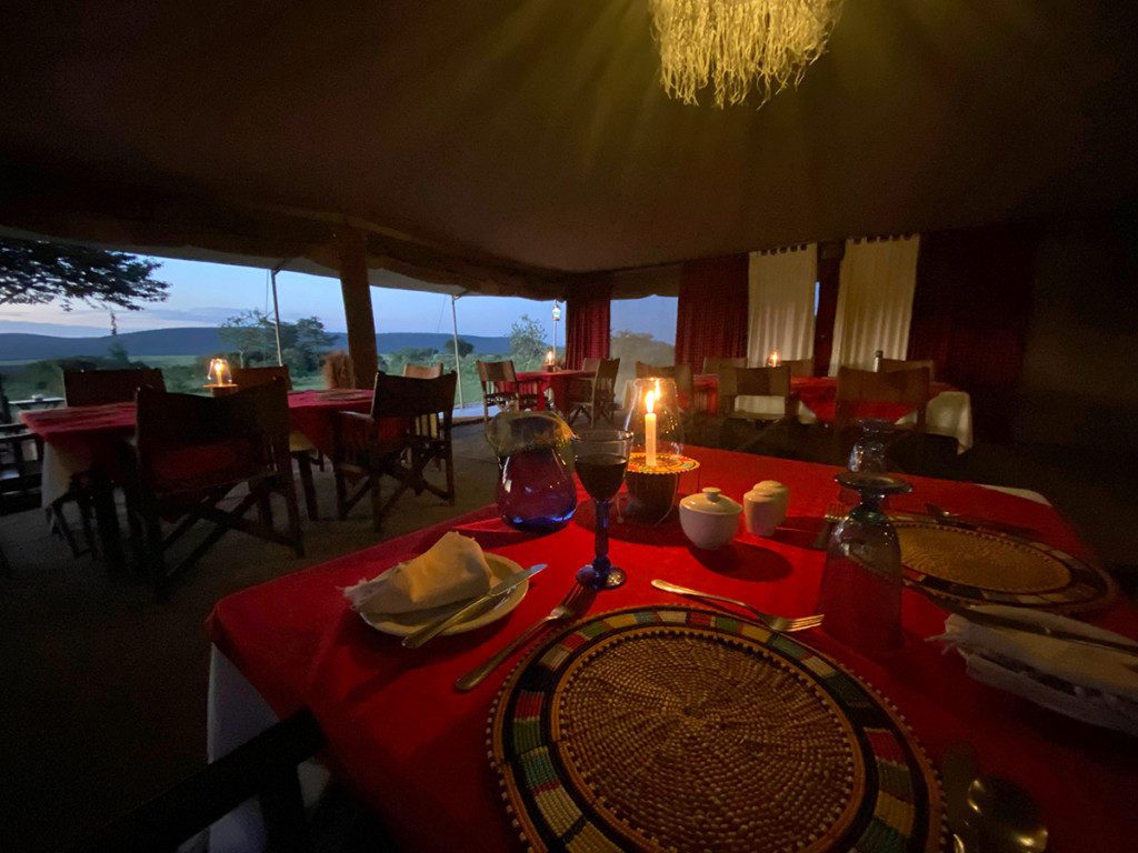 candlelit dining tent at eastern serengeti camp