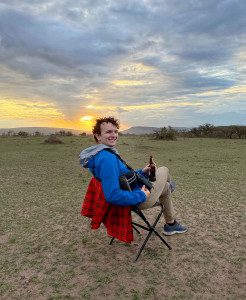 clark enjoying a sundowner in serengeti