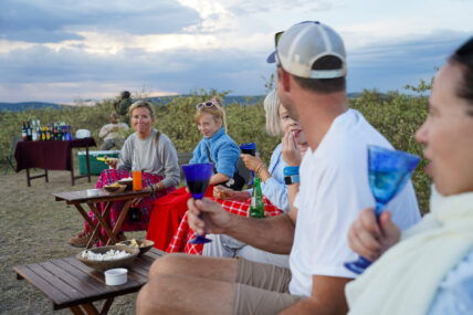 enjoying snacks by the campfire on a thomson family safari