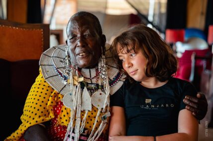 storyteller nekakki at camp with chelsea on our family safari