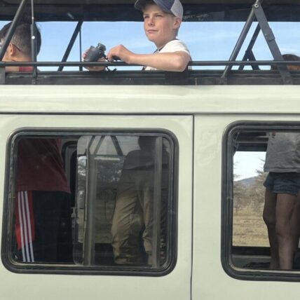 boy wildlife viewing on thomson family safari