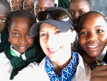 thomson guest with school children in tanzania