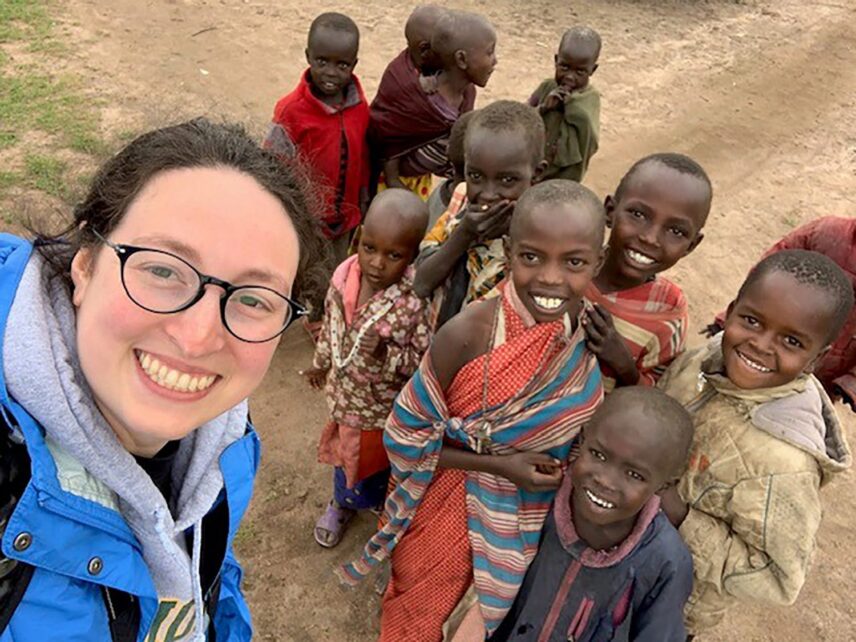 safari tourist with maasai children