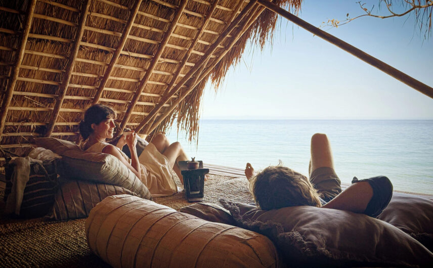 couple enjoying sundowners at greystoke mahale