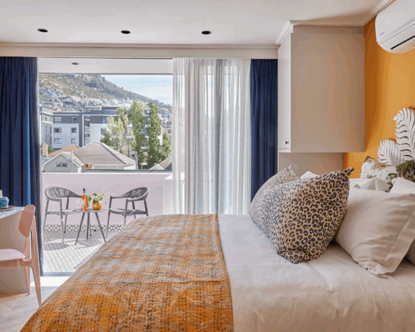 bedroom with open sliding doors at pineapple house boutique hotel cape town