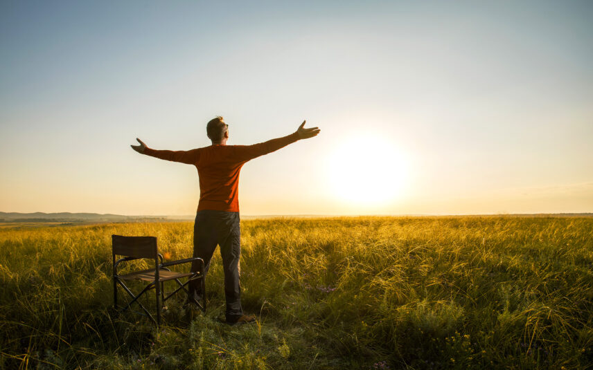 happy safari guest in savanna grasses