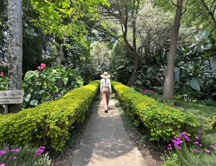 woman walking down path at hotel in arusha