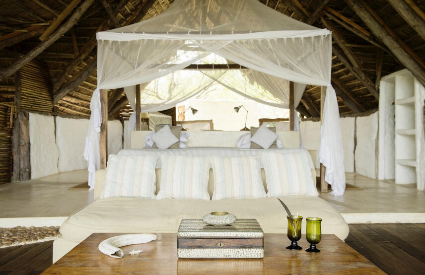 bedroom at sand rivers camp in nyerere national park
