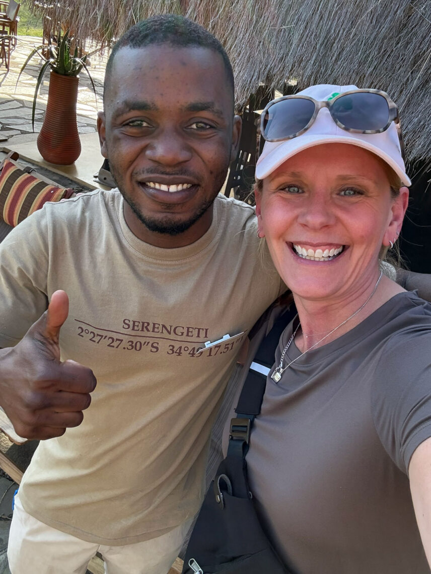 thomson guest with camp staffer idd at thomson serengeti nyumba camp